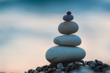 stack of zen stones on pebble beach