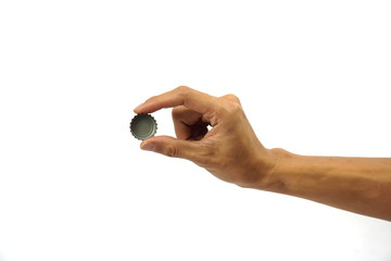 A Cropped of man hand holding bottle cap against white background.