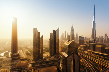 Fototapeta na wymiar Dubai skyline in the morning, aerial top view to downtown city center landmarks at sunrise. Famous viewpoint, United Arab Emirates