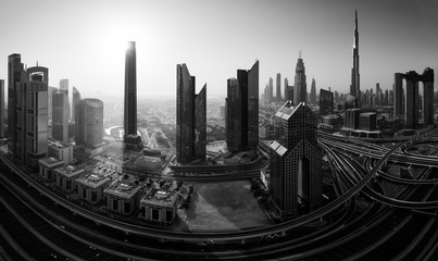 Dubai skyline in the morning, panoramic aerial top view to downtown city center landmarks at sunrise. Famous viewpoint, Black and white toned