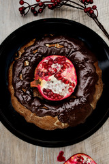 Homemade chocolate cake with pomegranate