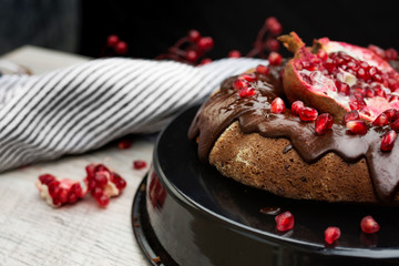 Cake with Chocolate Glaze and Pomegranate Seeds.
