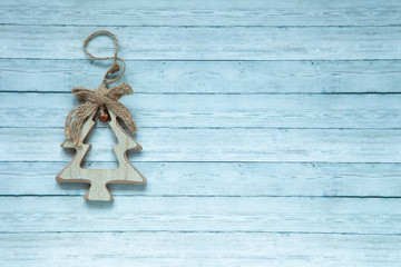 Wooden Christmas spruce on a wooden background, top view