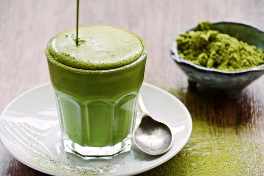 Matcha Latte on the wooden background