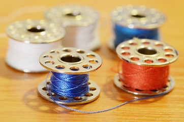 Coil with a sewing thread.
