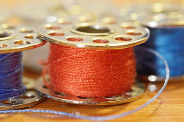 Coil with a sewing thread.