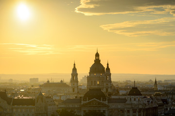 Fototapeta na wymiar Backlit St. Stephen's Basilica against Budapest skyline 