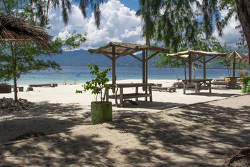 beach with chairs and umbrellas