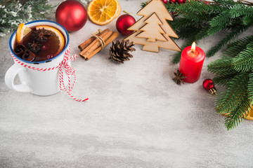 Mulled wine with spices and christmas decoration