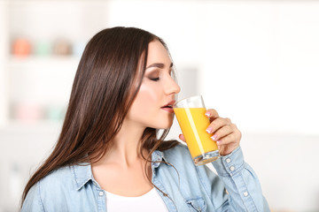 Beautiful woman drinking orange juice