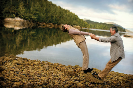 older couple by the side of a lake