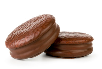 Chocolate biscuit sandwich close - up on a white background.