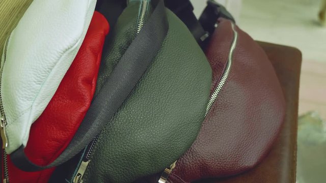 View of fanny packs of different colours during photoset
