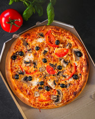 pizza, mushrooms, olives, chicken, tomato sauce, cheese, (pizza ingredients). hot pizza. Top view. copy space