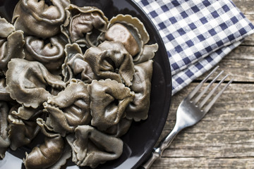 Squid ink tortellini pasta.