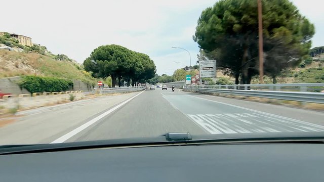 SICILY, ITALY on MAY 25th: Sign for Palermo and Messina in Sicily, Italy on May 25th, 2015.  Driving on AutoStrada A18 in Sicily. 