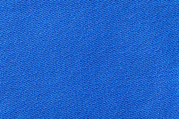 The linen cloth in blue color. Fabric background texture. Detail of textile material close-up