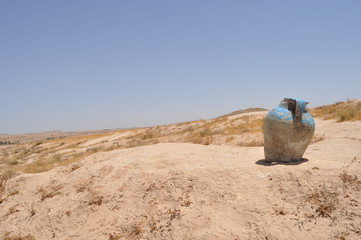 Decorative pitcher in the desert. Sahara.