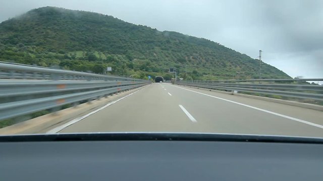 Approaching and driving into tunnel on the E90 in Sicily, Italy.