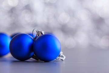 Christmas composition of Christmas tree toys on a blurred silver background