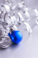 Christmas composition of Christmas tree toys on a blurred silver background