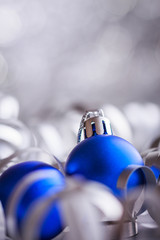 Christmas composition of Christmas tree toys on a blurred silver background