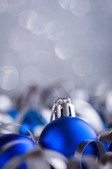 Christmas composition of Christmas tree toys on a blurred silver background