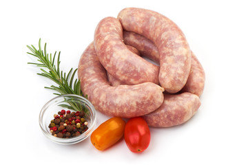 Fresh Sausages, Spiral Sausages with herbs and spices, isolated on a white background. Close-up