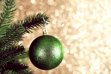 Christmas tree with bauble toy on blurred background