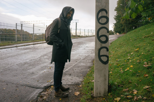 Mystery Man Next to a Satanic Graffiti.
