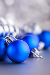 Christmas composition of Christmas tree toys on a blurred silver background