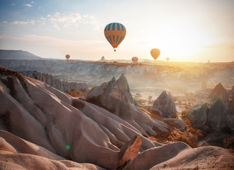 Hot air balloon flying over Cappadocia, Turkey - obrazy, fototapety, plakaty