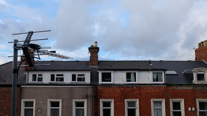 A row of terrace house with chimney and rectangle windows