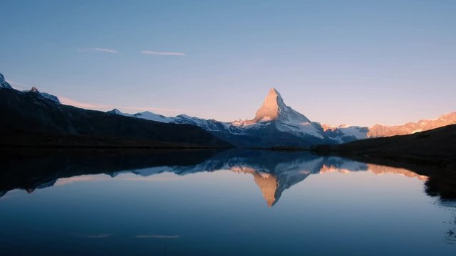 Picturesque view of Matterhorn Cervino peak and Stellisee lake in Swiss Alps. Zermatt resort location, Switzerland. Timelapse video