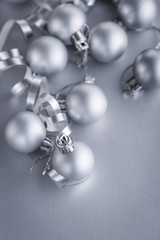 Christmas composition of Christmas tree toys on a blurred silver background