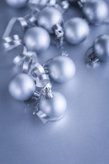 Christmas composition of Christmas tree toys on a blurred silver background