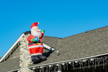 Santa Christmas decoration on a house chimney