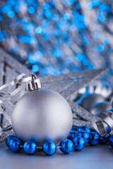 Christmas composition of Christmas tree toys on a blurred silver background