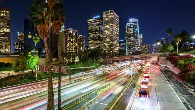 Freeway traffic in downtown Los Angeles at sunset