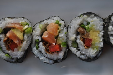 Sushi. Delicious meal with fish, rice and supplements, prepared at home.