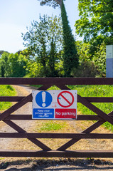Keep Clear and No Parking signs on gate