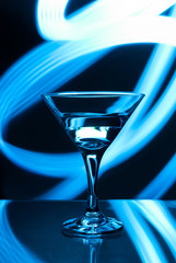 alcoholic glass in the club entourage, copy space, red background