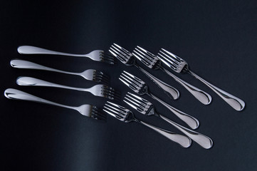 forks on black background
