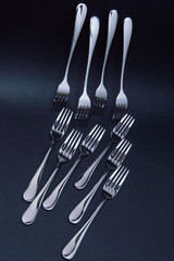 forks on black background
