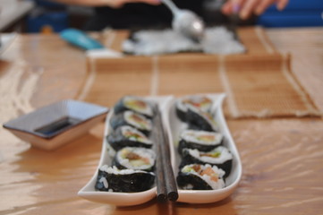 Sushi. Delicious meal with fish, rice and supplements, prepared at home.