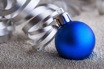 Christmas composition of Christmas tree toys on a blurred silver background