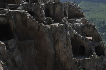 Old rock town in Vardzia, Georgia. The niches of the church and living quarters carved in a rock...
