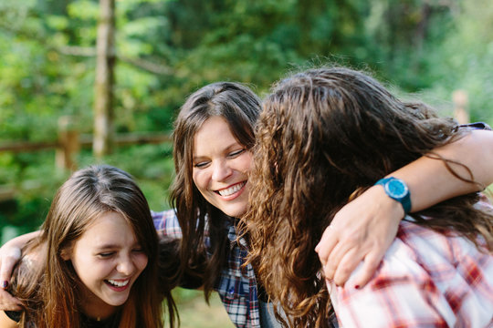 Happy Mother and Two Daughters Laughing
