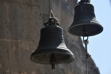 Obraz premium Mass bells in the old rock town of Vardzia in Georgia.