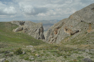 Taurus Mountains. Turkey. Steep cliffs and gorge. Snow-capped peaks.